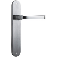 Pair of Iver Annecy lever door handles on oval backplates, featuring a sleek, modern design in polished finish.