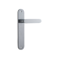 Pair of Iver Bronte lever door handles with oval backplates, featuring a sleek, modern design in a polished finish.