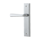 Pair of Iver Copenhagen architectural hardware levers with stepped backplate, showcasing sleek metal handles on a modern door.