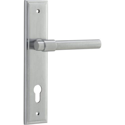 Pair of Iver Helsinki lever door handles on stepped backplates, showcasing sleek, modern design in a close-up view.