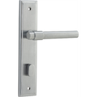 Pair of Iver Helsinki lever door handles on stepped backplate, showcasing sleek modern design and polished metal finish.