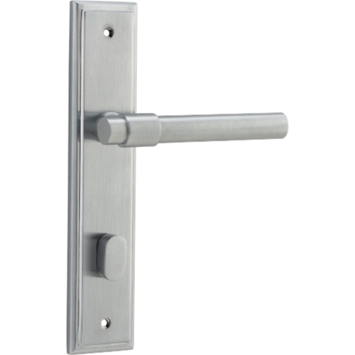 Pair of Iver Helsinki lever door handles on stepped backplate, showcasing sleek modern design and polished metal finish.