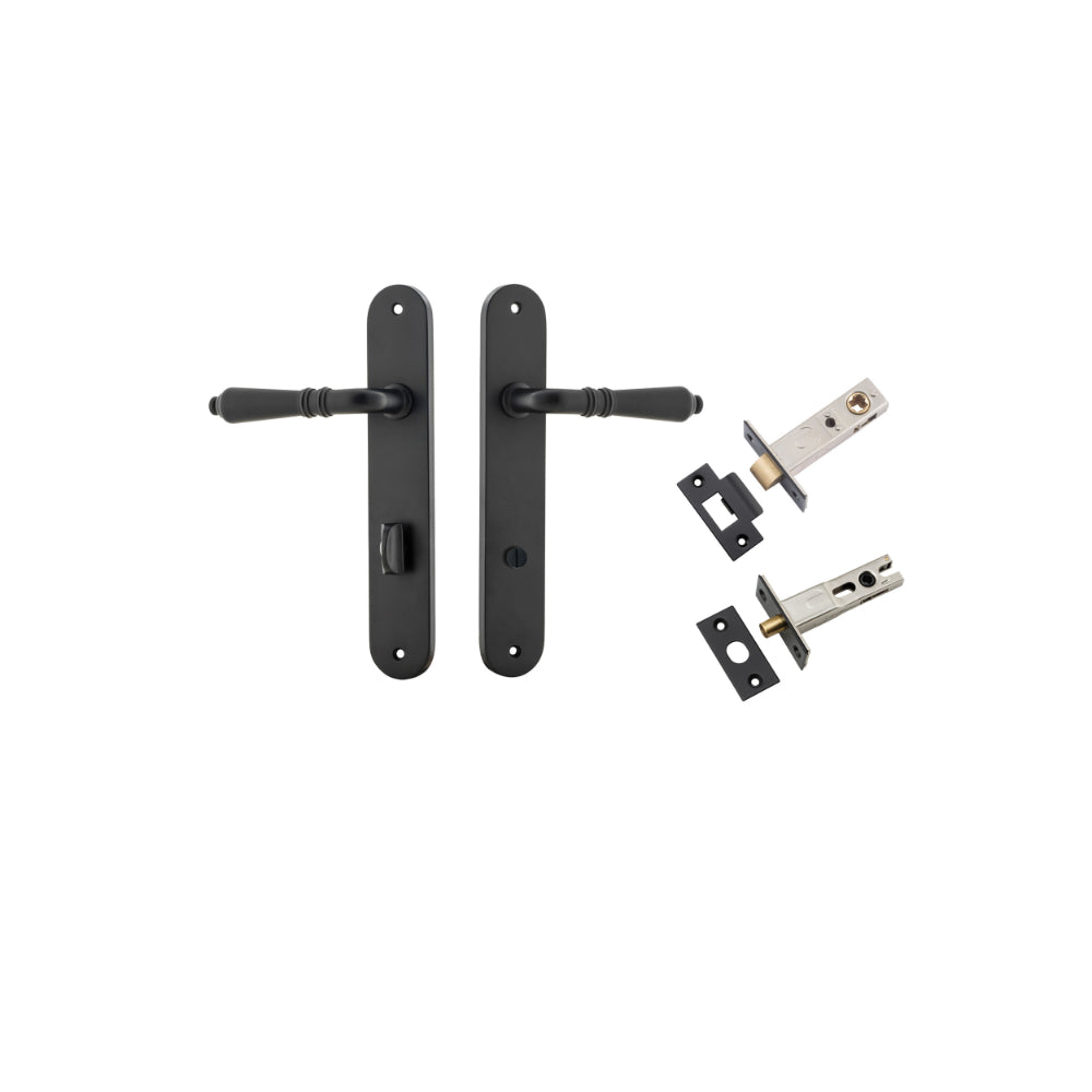 Pair of Iver Sarlat lever handles on oval backplates, featuring a sleek brass finish and modern design for interior doors.