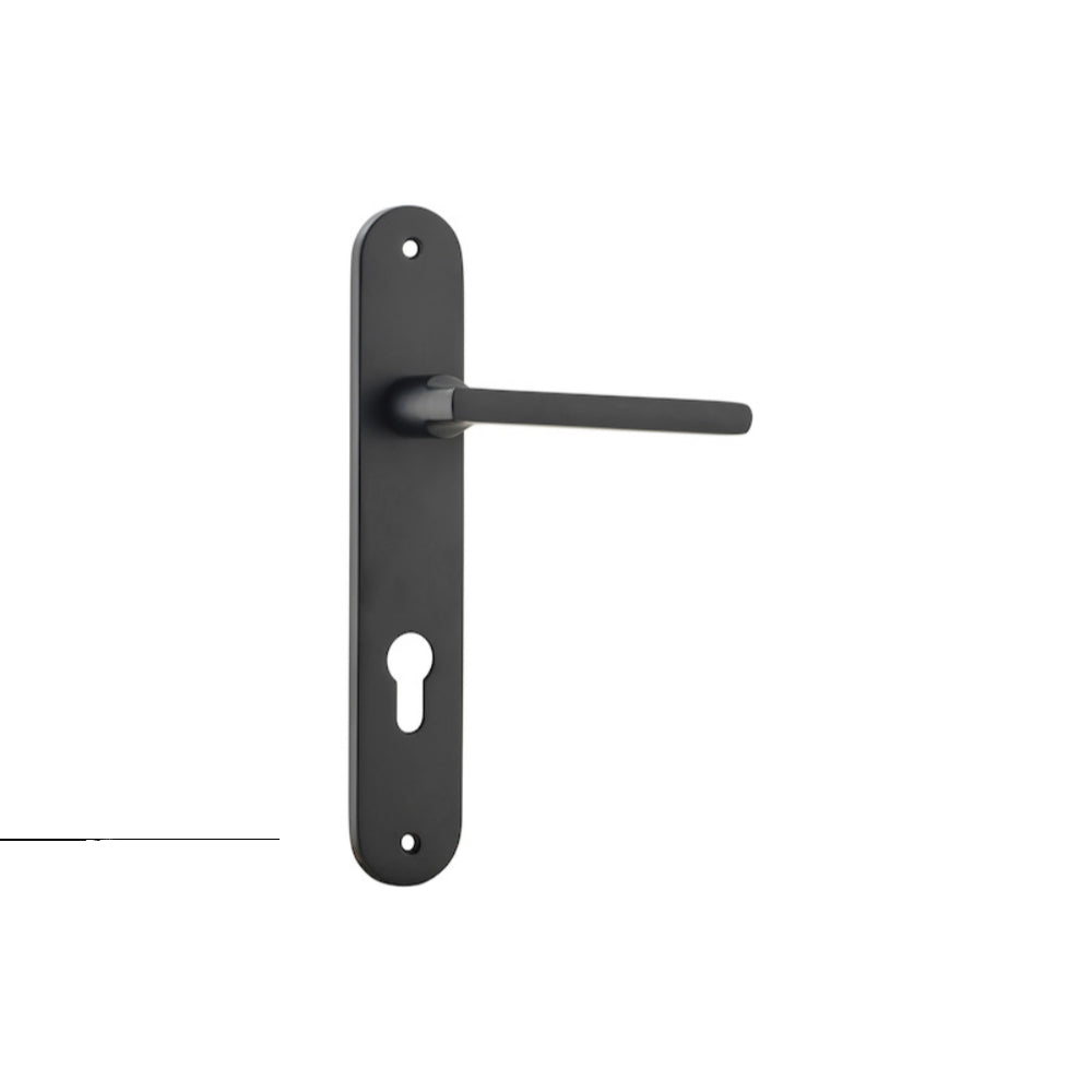 Pair of Iver Baltimore lever door handles on oval backplates, featuring a sleek, modern design with a polished finish.