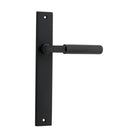 Pair of Iver Brunswick lever door handles on rectangular backplates, featuring a sleek, modern design for interior doors.