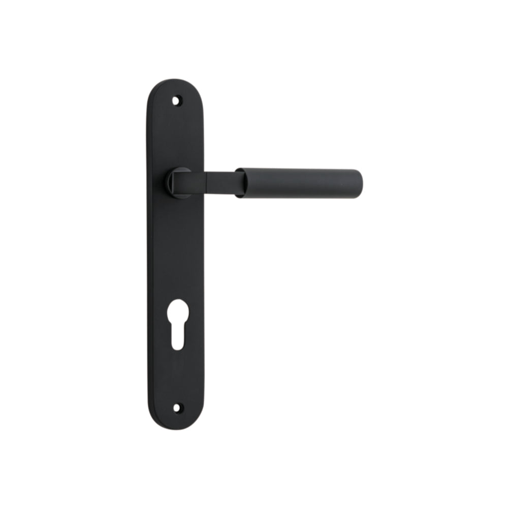 Pair of Iver Berlin lever door handles on oval backplates, featuring sleek modern design and polished metal finish.