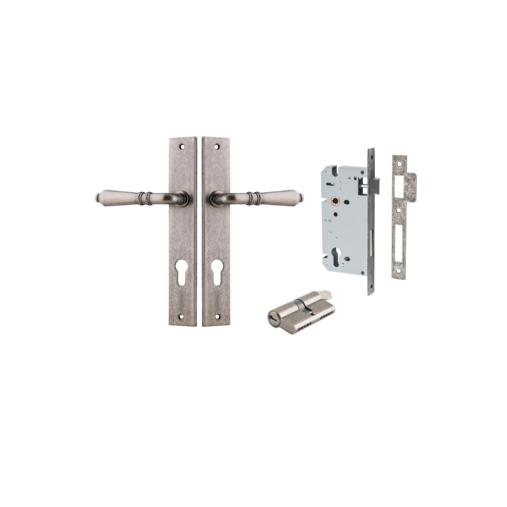 Pair of Iver Sarlat lever door handles with rectangular backplates in a sleek, modern design, shown on a pair of doors.