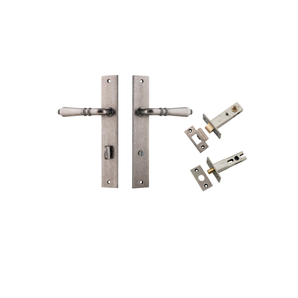 Pair of Iver Sarlat lever handles with rectangular backplates, featuring a sleek brass finish and modern design for doors.