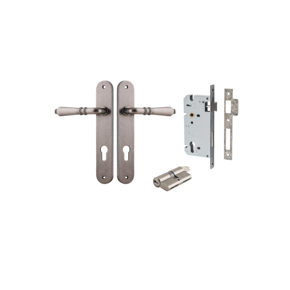 Pair of Iver Sarlat lever door handles on oval backplates, featuring a sleek, modern design in a polished finish