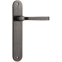 Pair of Iver Annecy lever handles on oval backplates, featuring elegant brass finish and modern design for stylish door hardware.