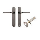 Pair of Iver Annecy lever door handles on oval backplates, featuring sleek brass finish and modern design.