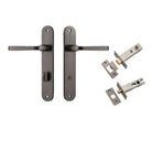 Pair of Iver Annecy lever door handles with oval backplates, showcasing polished brass finish and elegant design.