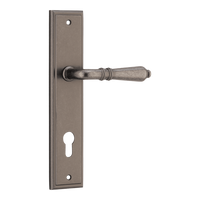 Pair of Iver Sarlat lever handles on stepped backplates, showcasing elegant brushed metal finish and classic door hardware design.