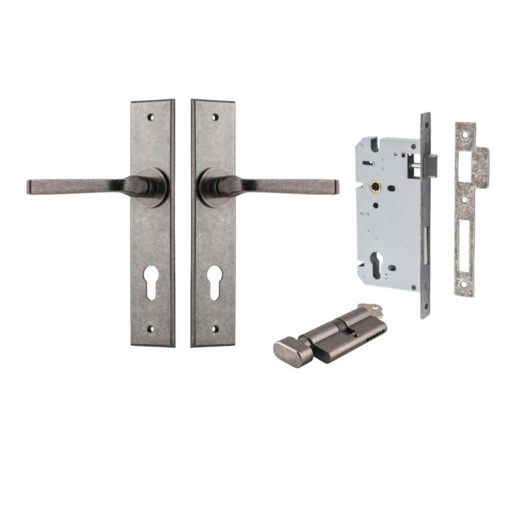 Pair of Iver Annecy lever door handles on chamfered backplates, featuring a sleek, modern design in a natural finish.