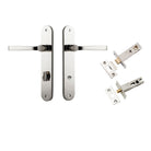 Pair of Iver Annecy lever door handles on oval backplates, featuring elegant, polished brass finish for stylish interior doors.