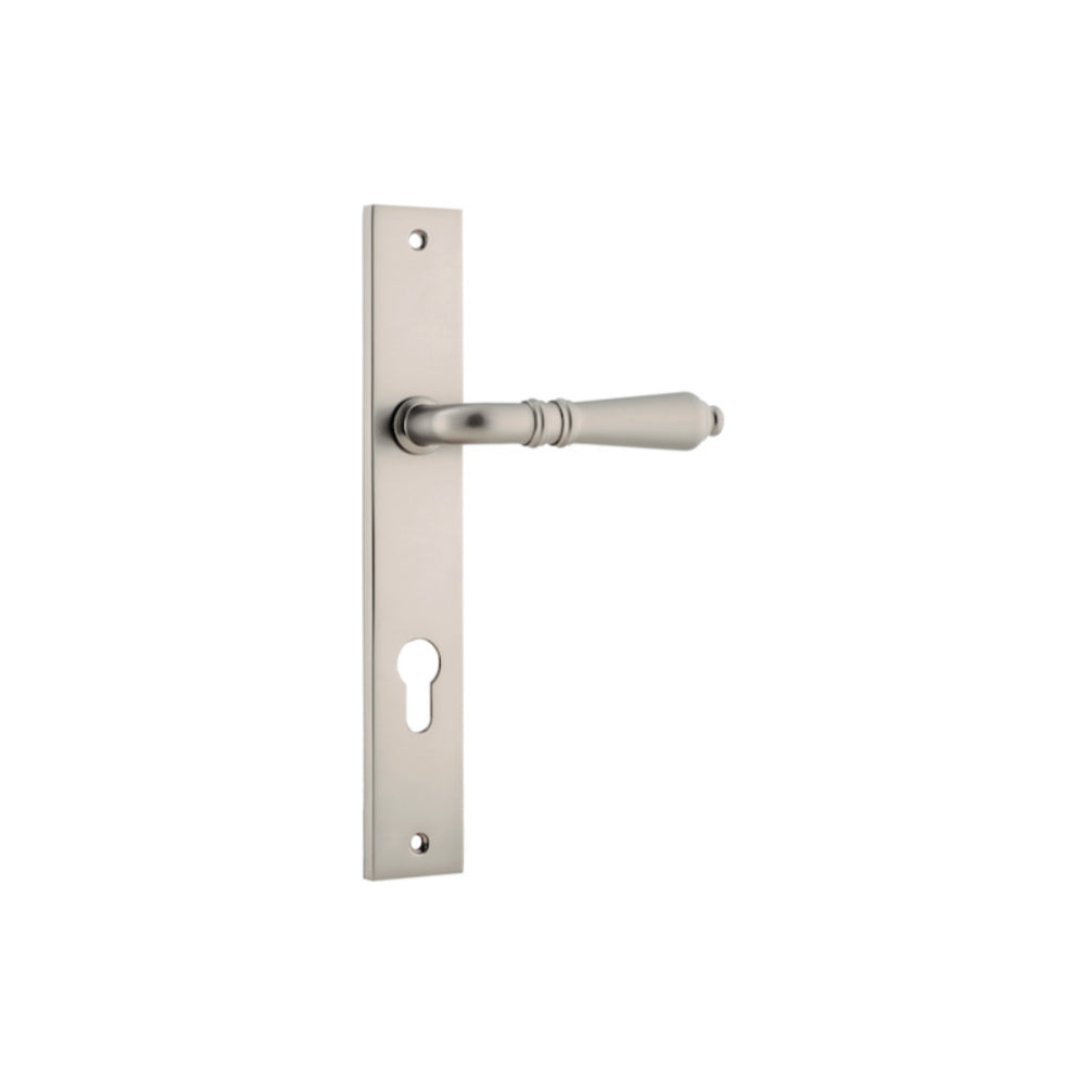 Pair of Iver Sarlat lever handles on rectangular backplates, featuring a modern bronze finish with intricate detailing.