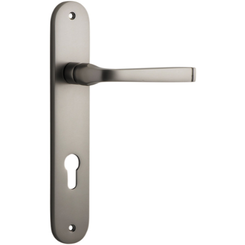 Pair of Iver Annecy lever handles on oval backplates, featuring polished brass finish and elegant design for doors.