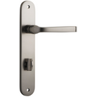Pair of Iver Annecy lever door handles on oval backplates, featuring a sleek modern design in polished metal finish.