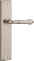 Pair of Iver Sarlat lever handles on stepped backplates, featuring classic brass finish and elegant design for interior doors.