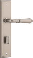 Pair of Iver Sarlat lever handles on stepped backplates, showcasing elegant door hardware with a polished finish.