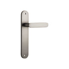 Pair of Iver Bronte lever door handles on oval backplates, featuring a sleek, modern design for stylish interior doors.