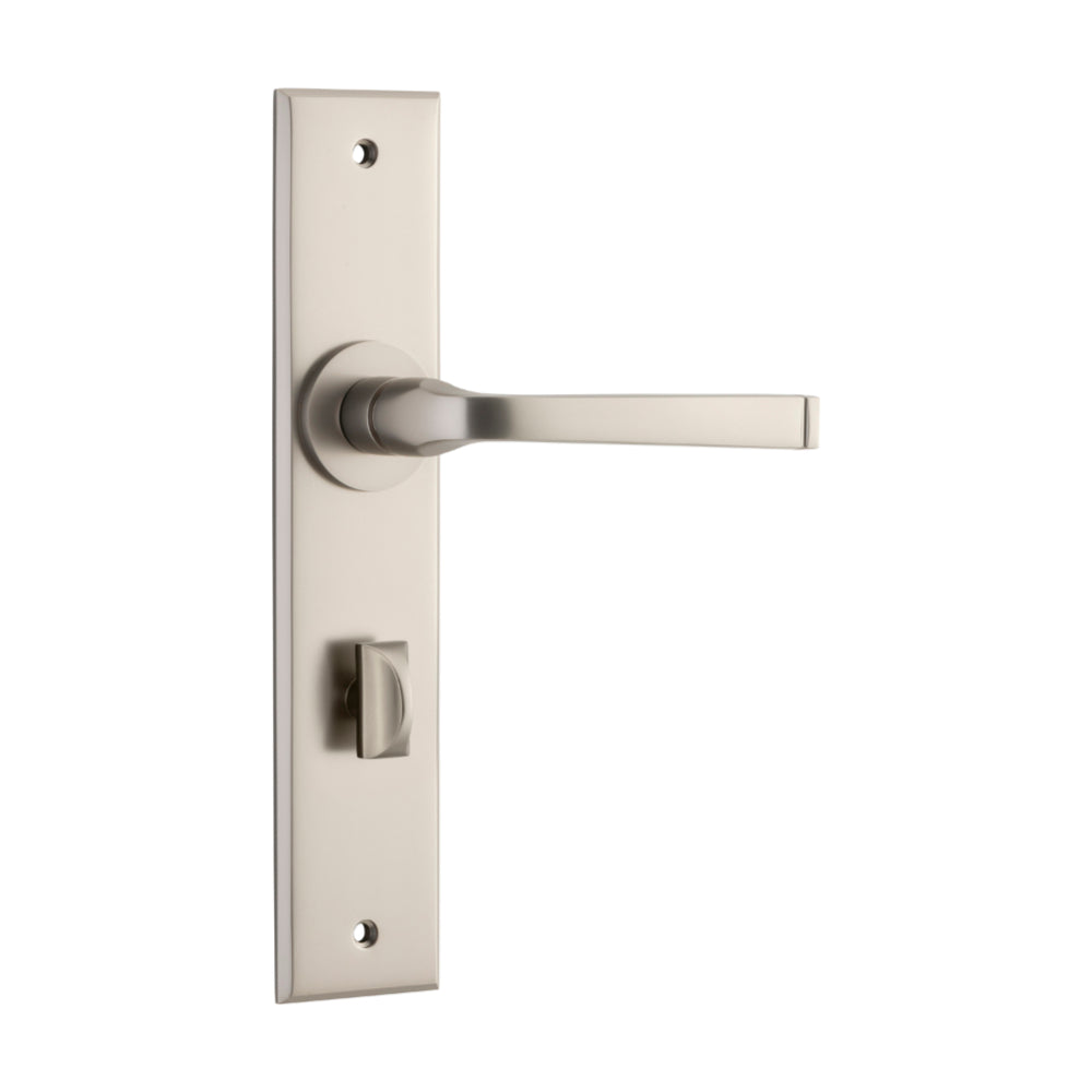 Pair of Iver Annecy lever door handles with chamfered backplates, showcasing elegant brass finish and modern design for interior doors.