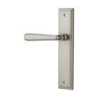 Pair of Iver Copenhagen lever handles on stepped backplates, modern architectural hardware for doors, shown in a sleek metallic finish.