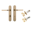 Pair of Iver Annecy lever handles on oval backplates, made of polished brass for modern bathroom or kitchen cabinets.