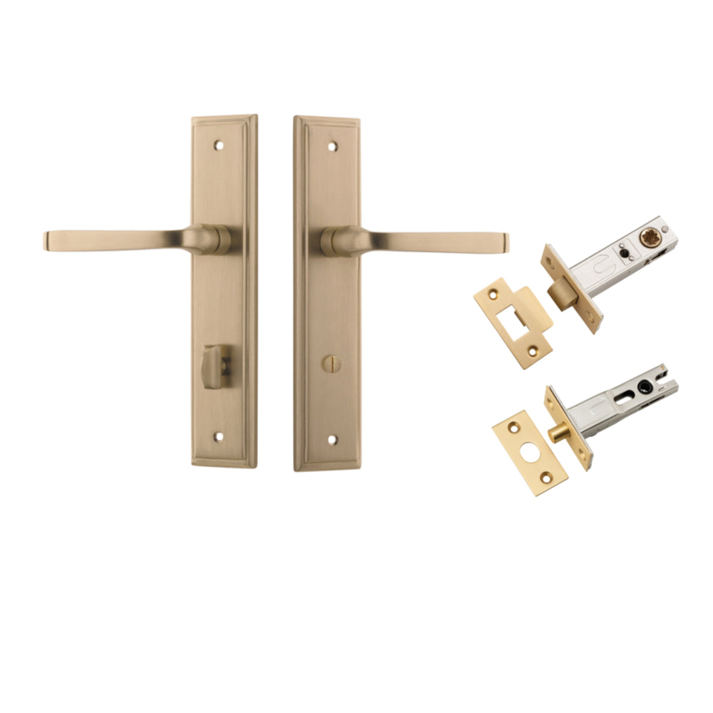 Pair of Iver Annecy lever door handles on stepped backplates, with polished brass finish, shown on an elegant door.
