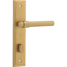 Pair of Iver Helsinki lever door handles on stepped backplates, showcasing sleek, modern design in polished finish.