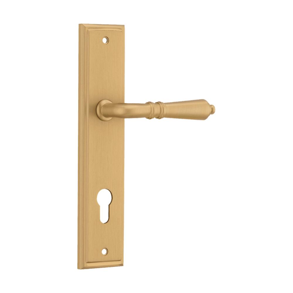 Pair of Iver Sarlat lever handles on stepped backplates with a polished brass finish, designed for classic interior doors.