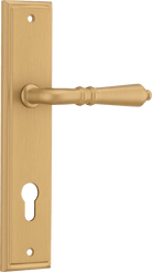 Pair of Iver Sarlat lever handles on stepped backplates with a polished brass finish, designed for classic interior doors.