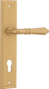 Pair of Iver Sarlat lever handles on stepped backplates with a polished brass finish, designed for classic interior doors.