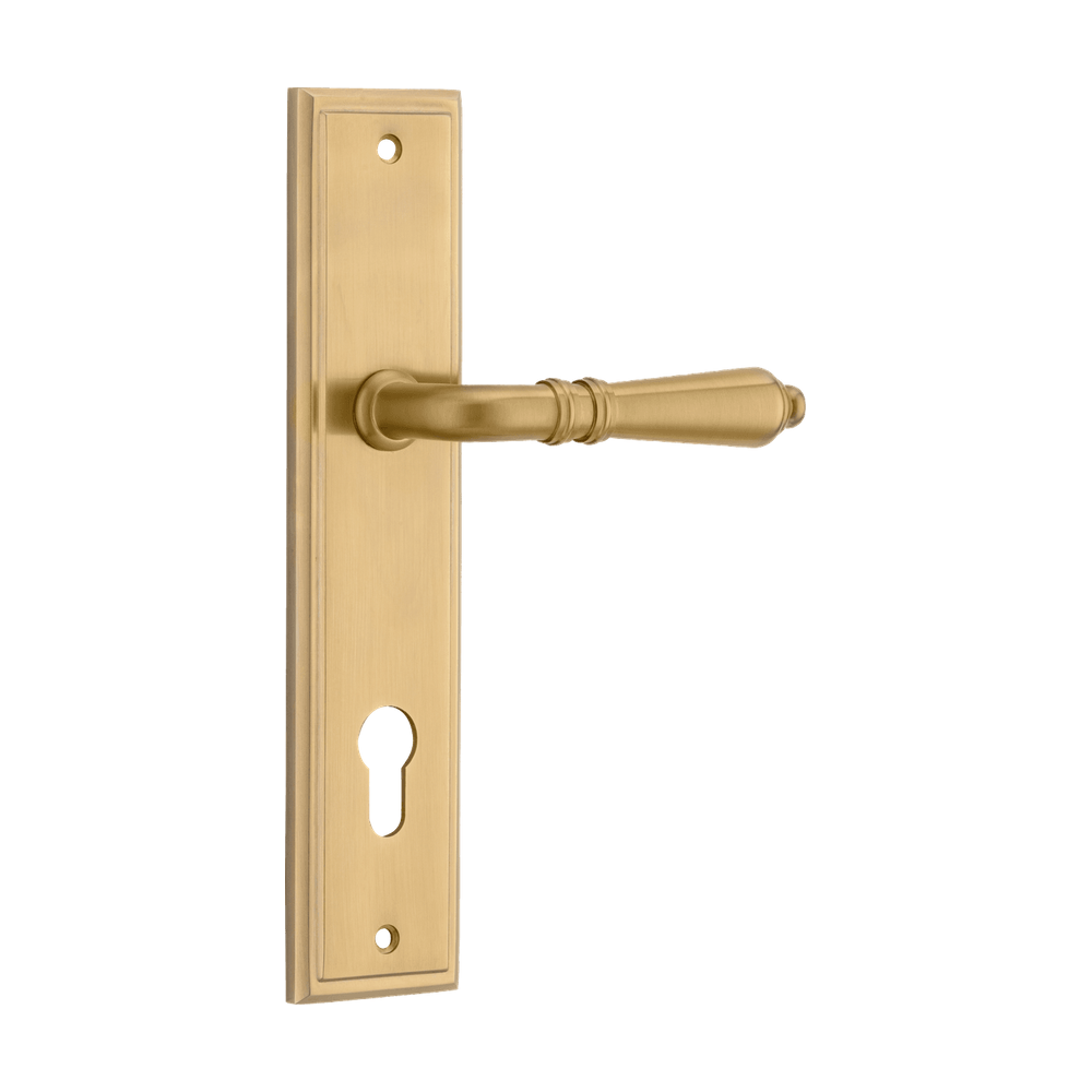 Pair of Iver Sarlat lever door handles on stepped backplate, showcasing elegant metal hardware with a polished finish.