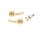 Pair of Iver Brunswick lever door handles on round rose plates, featuring a sleek, modern design for interior doors.