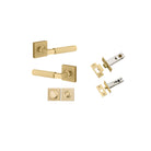 Pair of Iver Brunswick lever handles on square rose, polished brass finish, designed for interior door hardware.