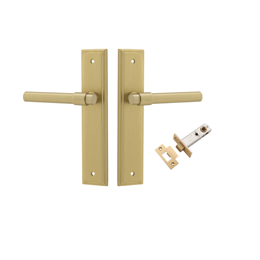 Pair of Iver Helsinki lever door handles with stepped backplate in a polished finish, shown on a close-up of the hardware.