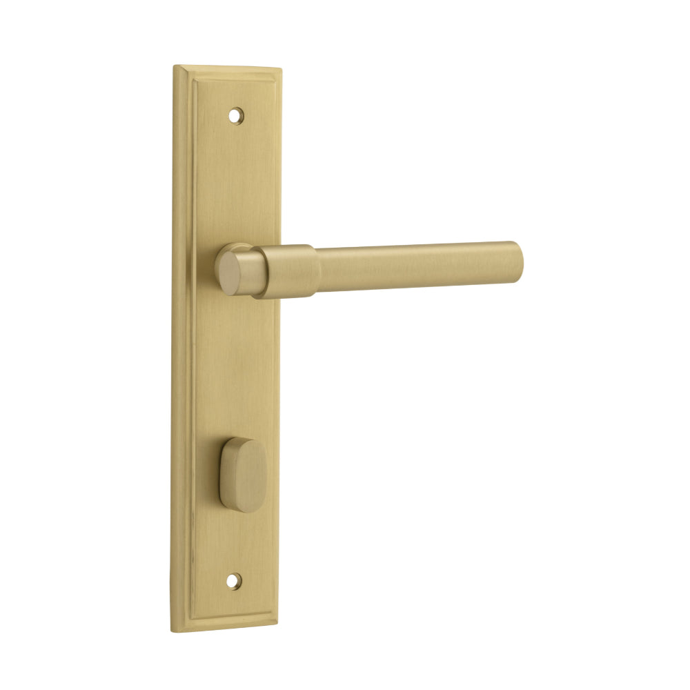 Pair of Iver Helsinki lever door handles on stepped backplates, showcasing modern brass hardware with a sleek, polished finish.