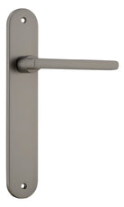 Pair of Iver Baltimore lever door handles on oval backplates, featuring a sleek, modern design in a polished finish.