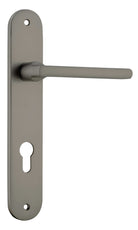 Pair of Iver Baltimore lever door handles on oval backplates, featuring a sleek, modern design in a polished finish.