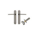 Pair of Iver Baltimore lever handles on oval backplates, featuring a sleek, modern design for interior doors.