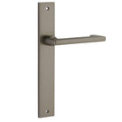 Pair of Iver Baltimore return lever handles on rectangular backplates, featuring a sleek, modern design for interior doors.