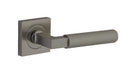 Pair of Iver Brunswick lever door handles on square rose, featuring classic brass finish and elegant design for interior doors.