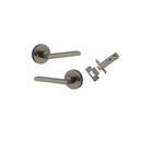 Pair of Iver Baltimore lever door handles on round rose, featuring a sleek finish and modern design for stylish interior doors.