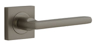 Pair of Iver Baltimore lever door handles on square rose, featuring a sleek, modern design with a satin finish.