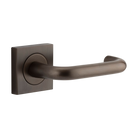 Pair of Iver Oslo Lever on Square Rose architectural hardware, featuring sleek metal handles on square rose plates.