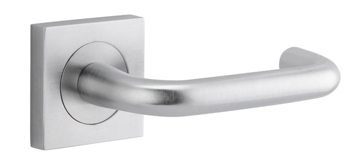 Pair of Iver Oslo Lever handles on square rose, architectural hardware in a modern design, shown in a close-up image.