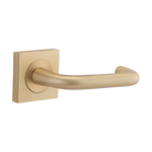 Pair of Iver Oslo Lever handles on square rose, architectural hardware with sleek modern design in a natural finish.