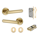 Pair of Iver Puerto lever handles on round rose, featuring a sleek brass finish and modern design for interior doors.