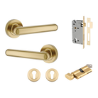 Pair of Iver Puerto Lever handles on round rose plates, featuring a sleek, modern design in a polished finish.